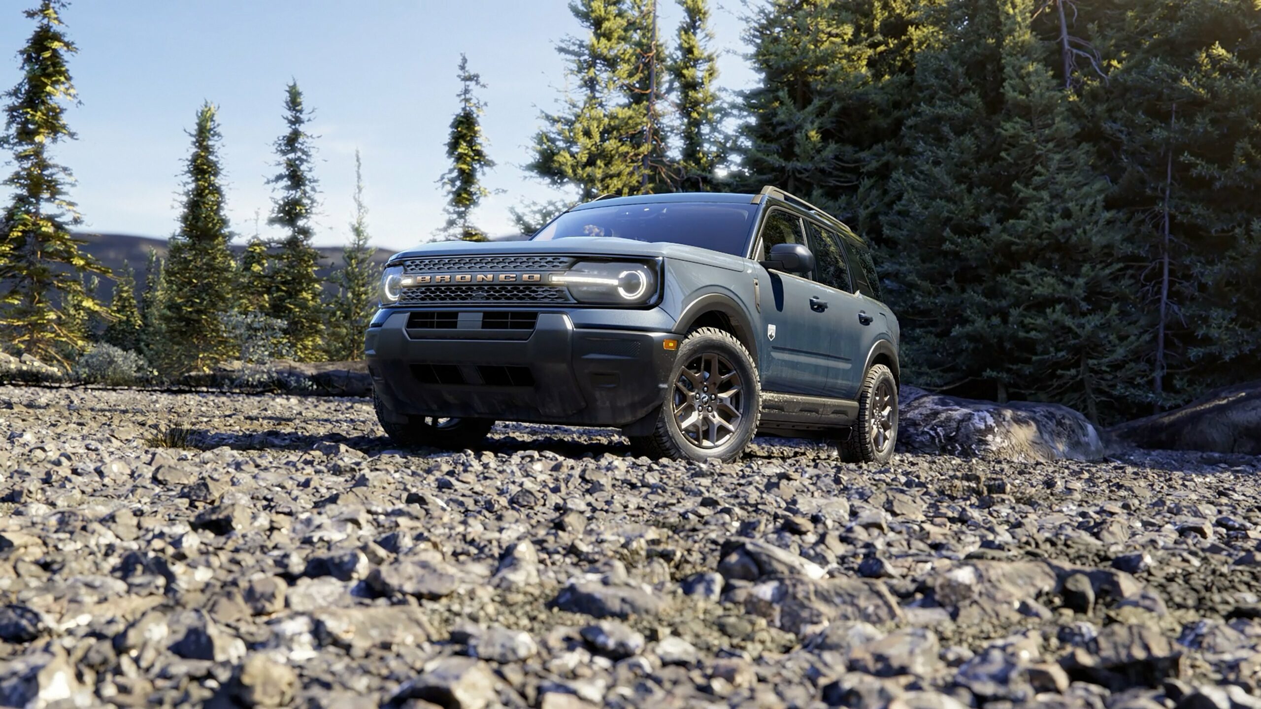 A 2026 Ford Bronco Sport Big Bend on a rocky trail among pines