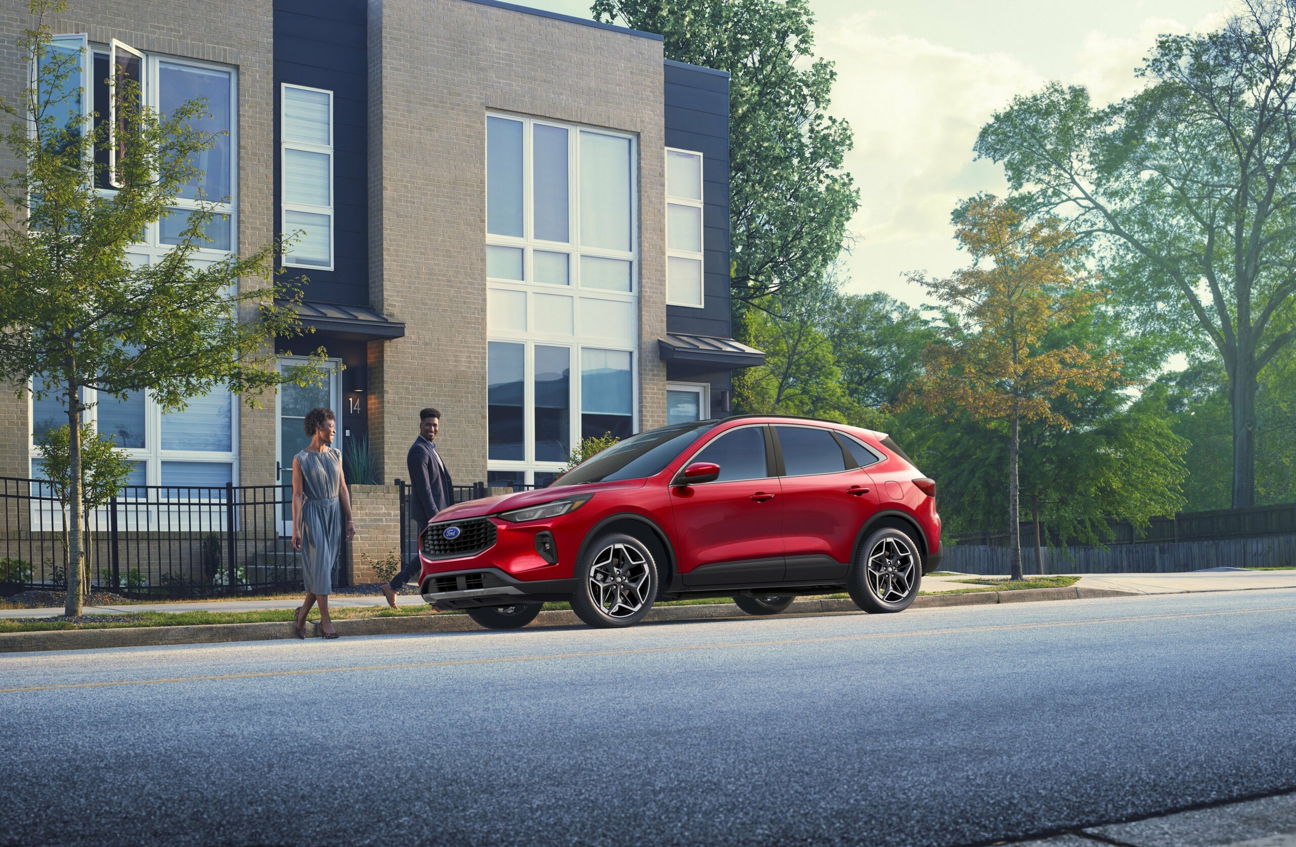 A 2026 Ford Escape ST-Line Elite in Rapid Red on a city street