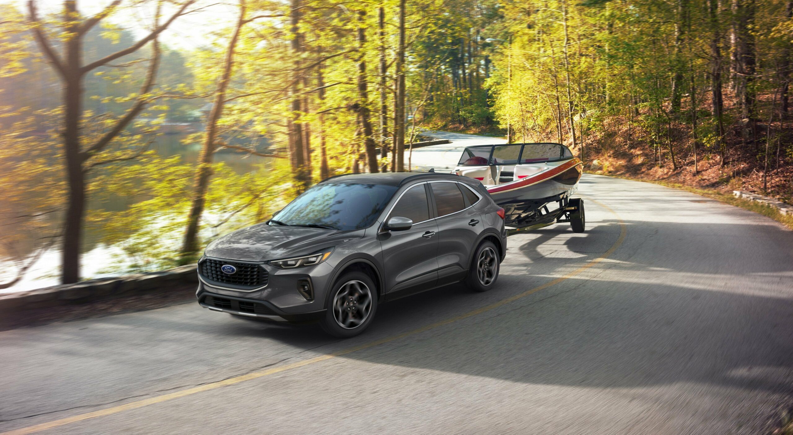 A 2026 Ford Escape towing a boat on a trailer along a country road