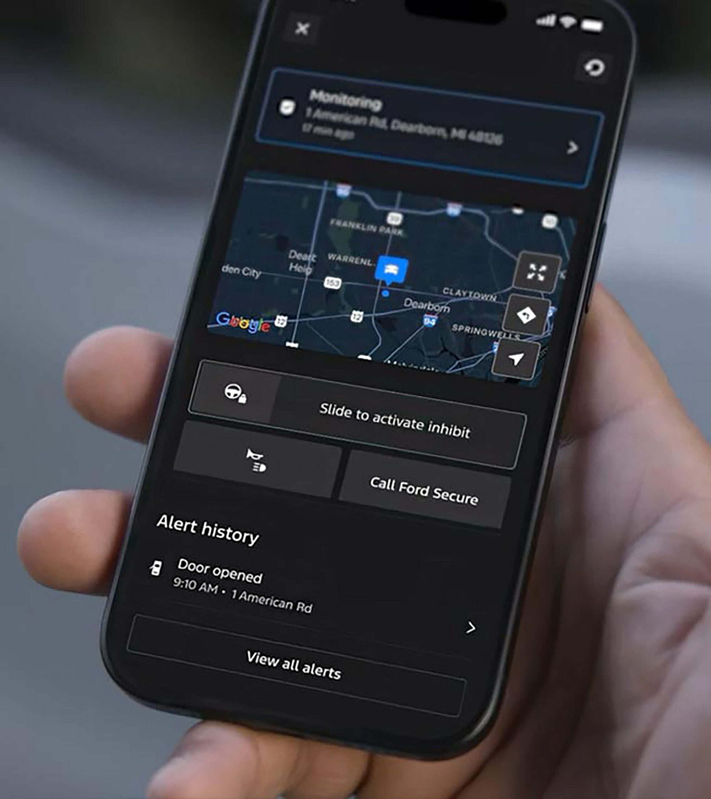 A phone showing Ford Security Package alerts for a 2027 Ford Explorer