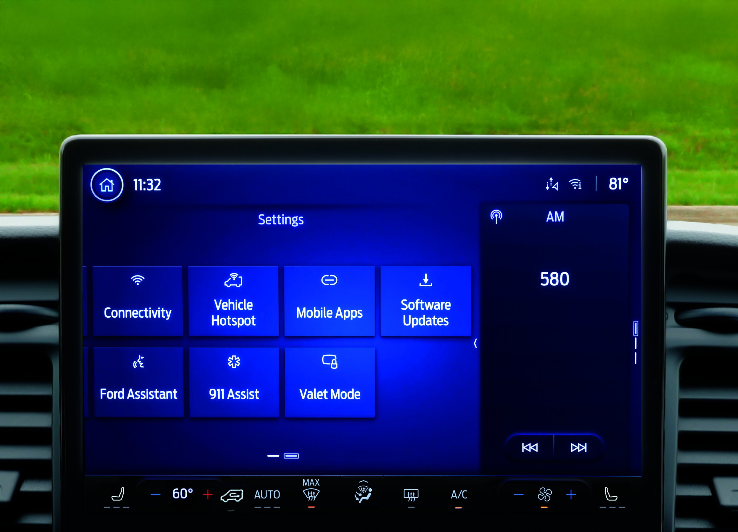 The Ford E-Transit SYNC 4 center touchscreen showing the settings menu, with tiles for connectivity, vehicle hotspot, mobile apps and software updates