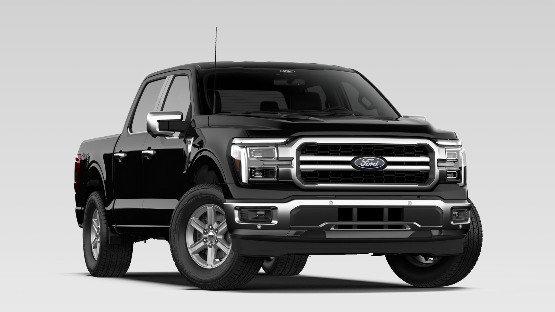 A 2026 Ford F-150 Lariat SuperCrew in Agate Black Metallic with a chrome grille bar and machined aluminum wheels
