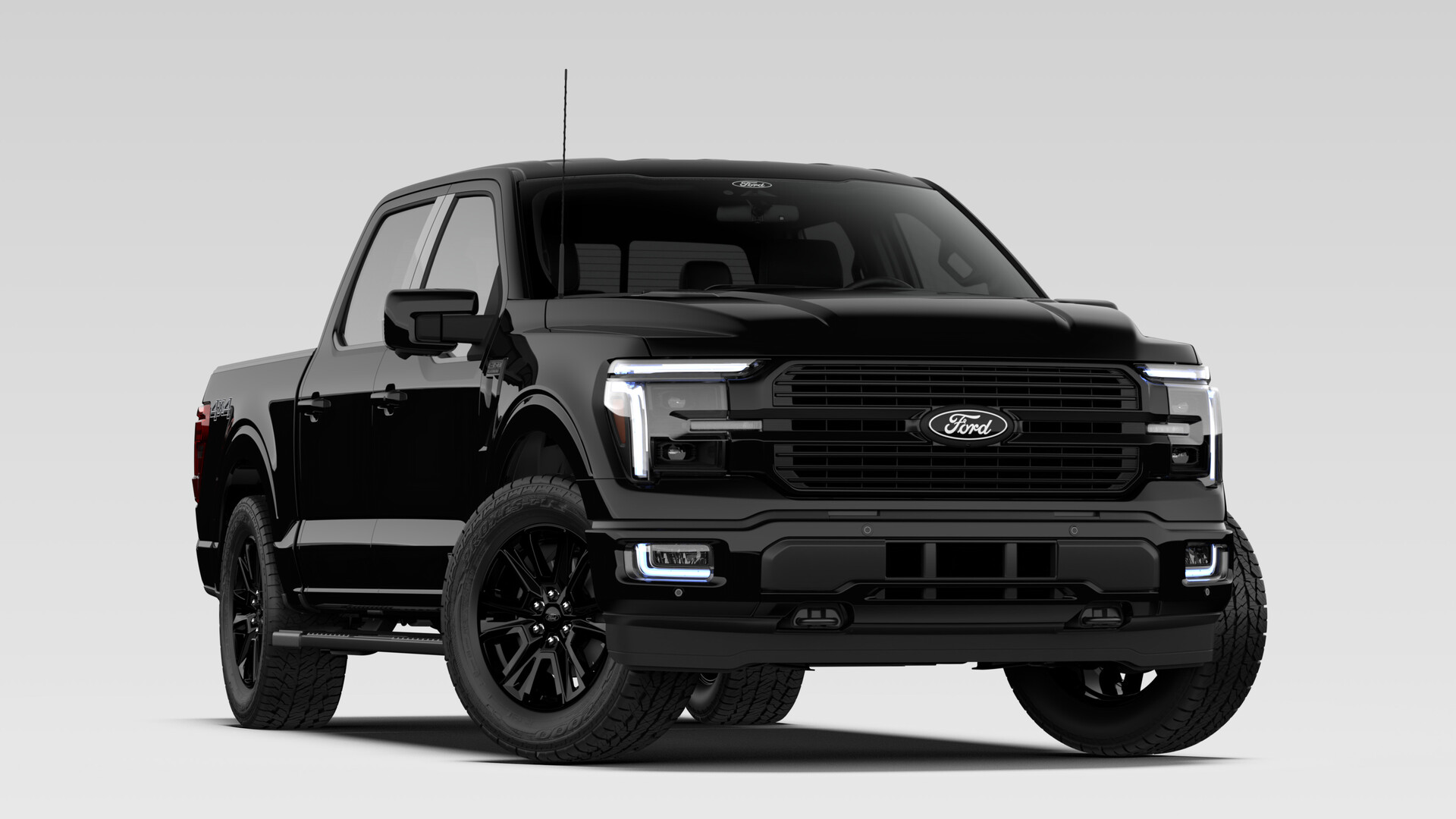 A 2026 Ford F-150 Platinum SuperCrew in Agate Black Metallic with a satin-framed mesh grille and dark wheels