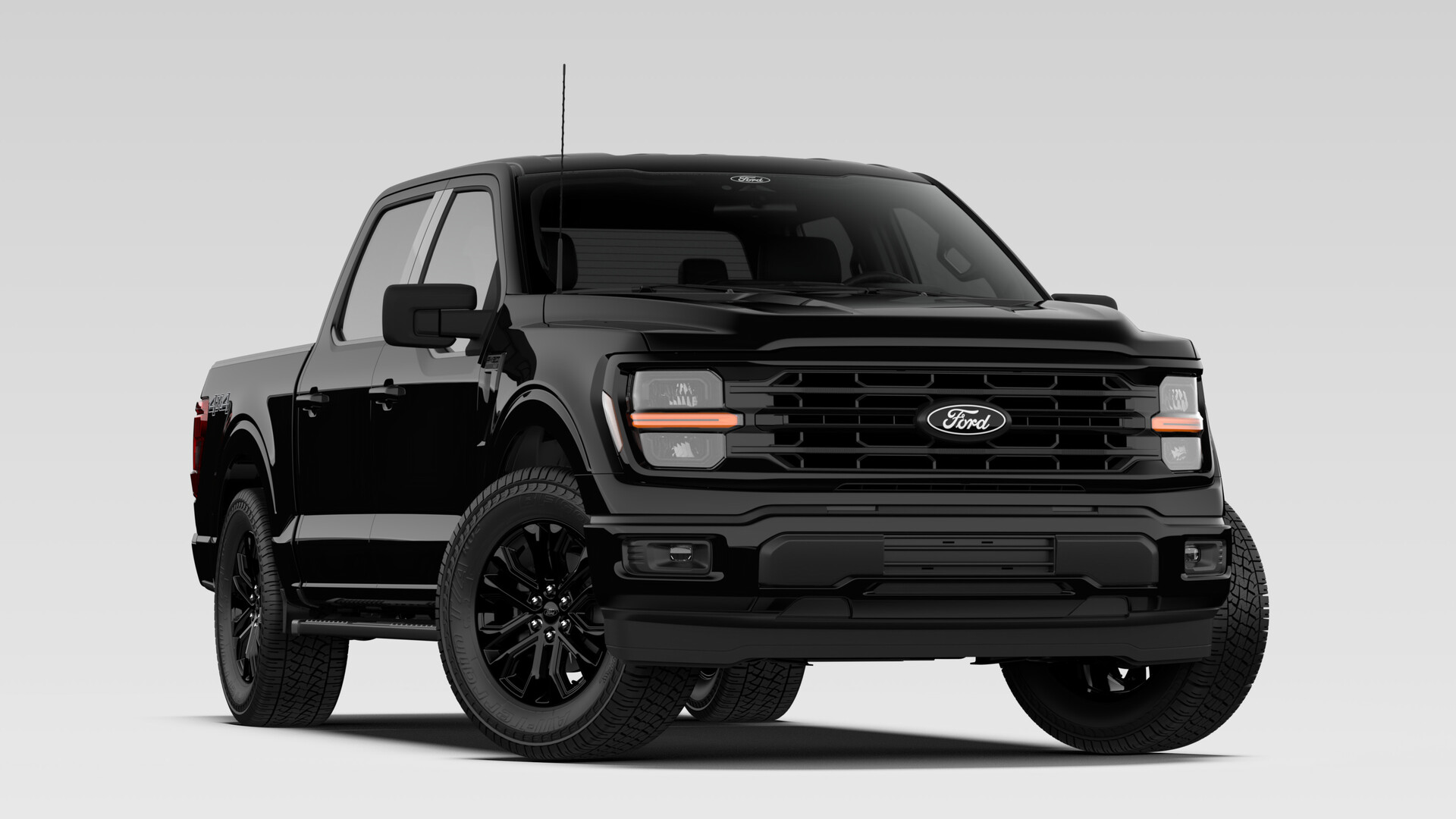 A 2026 Ford F-150 XLT SuperCrew in Agate Black Metallic with the Black Appearance Package and gloss-black wheels