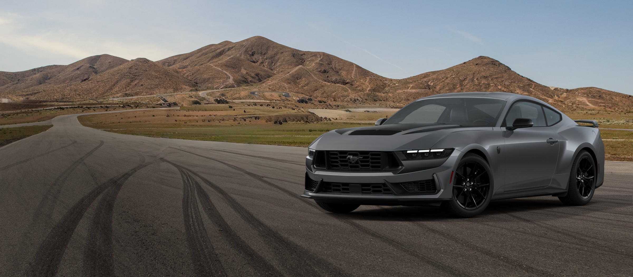 A gray 2026 Ford Mustang Dark Horse on a desert road