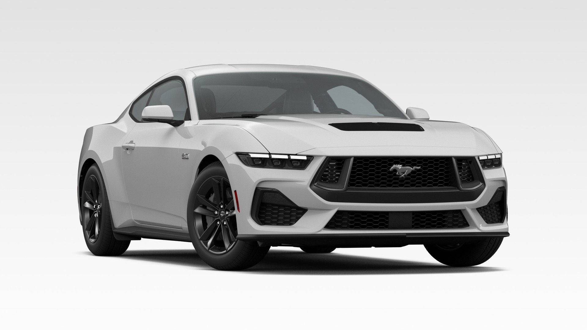 An Avalanche Gray 2026 Ford Mustang GT Fastback in three-quarter front view, with hood vents and gloss-black wheels
