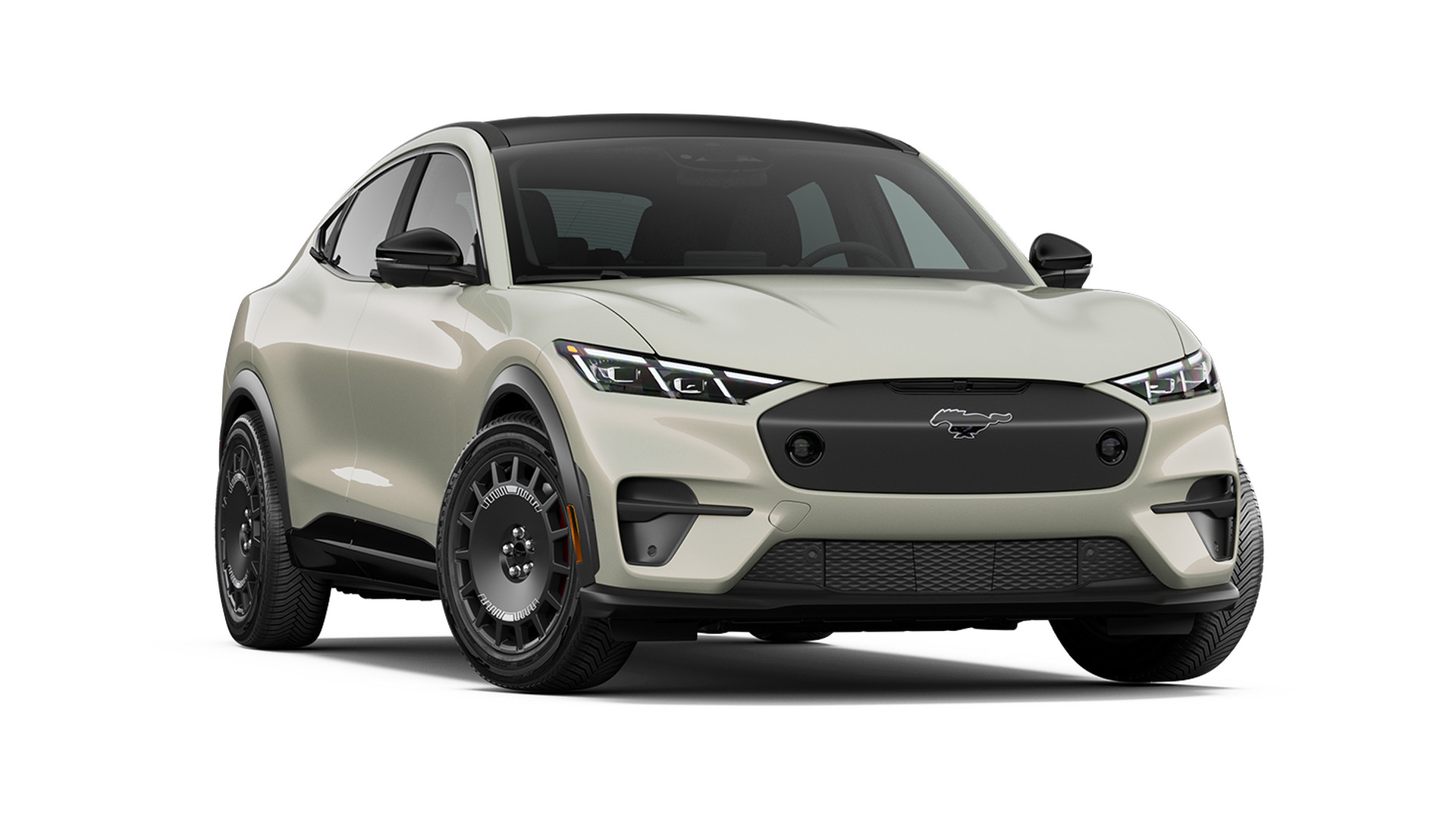 A 2026 Ford Mustang Mach-E Rally in a pale sand finish with a black roof, front three-quarter studio render, raised ride height and chunky black wheels with gold brake calipers