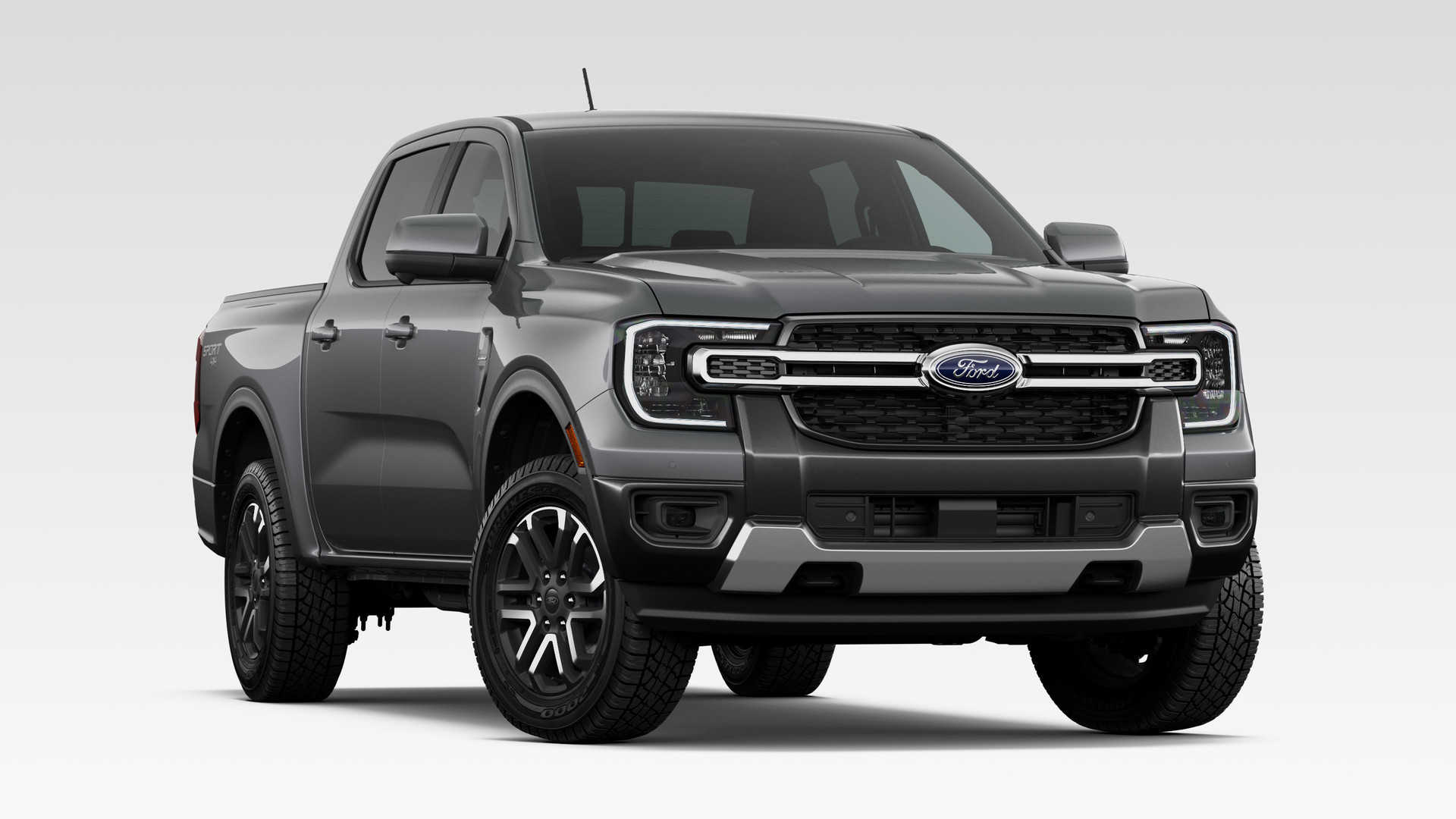 A Carbonized Gray Metallic 2026 Ford Ranger Lariat SuperCrew with the Sport Appearance Package, front three-quarter studio render, chrome grille bars and dark machined alloy wheels